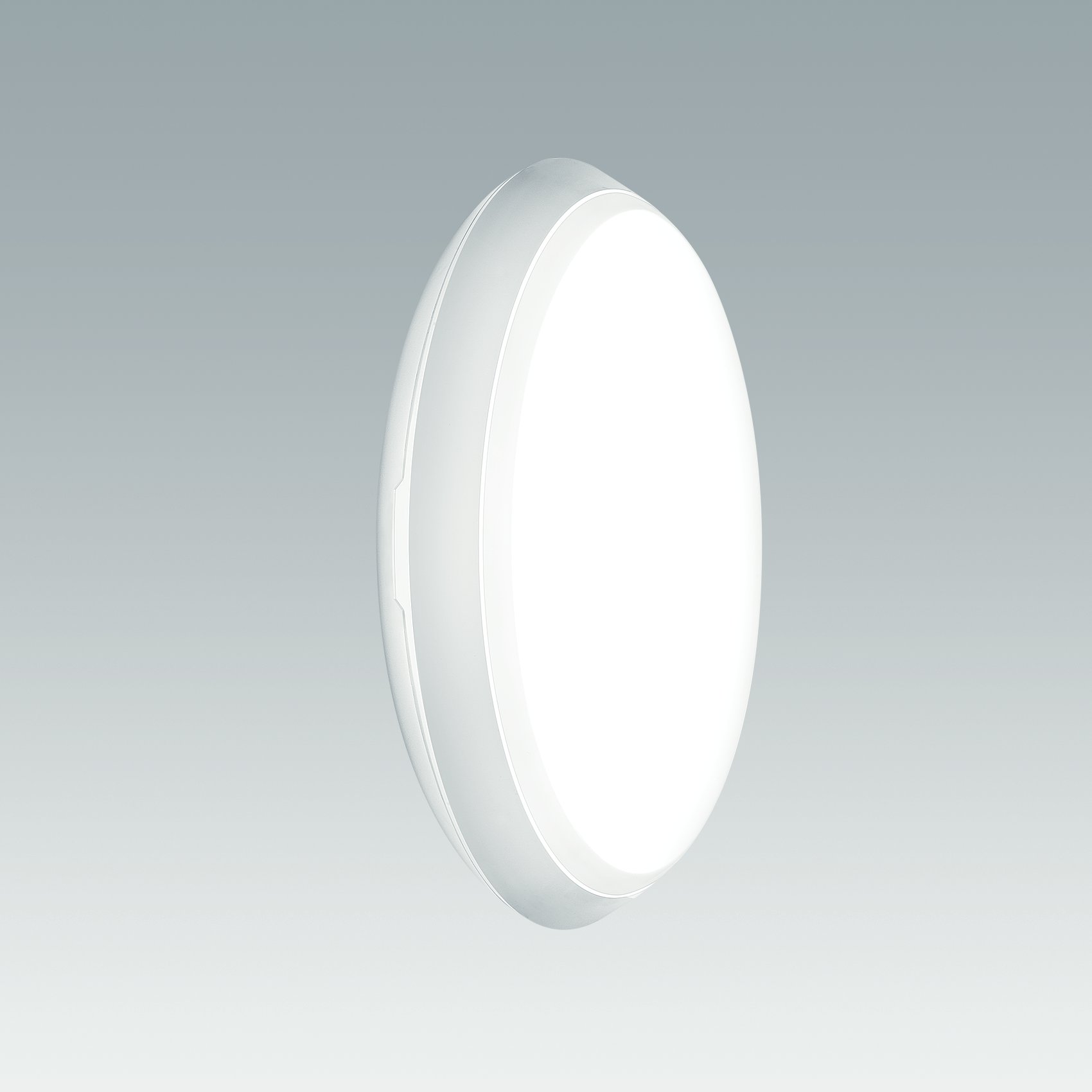 Een ronde ledlamp voor wand- of plafondmontage met een compact en strak ontwerp. De armatuur straalt zacht, diffuus licht uit, waardoor het geschikt is voor woon- of commerciële omgevingen.