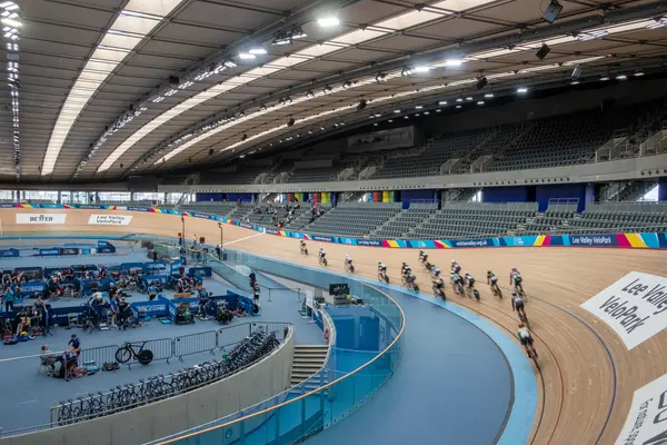 Indoor velodrome with cyclists taking part in a competition