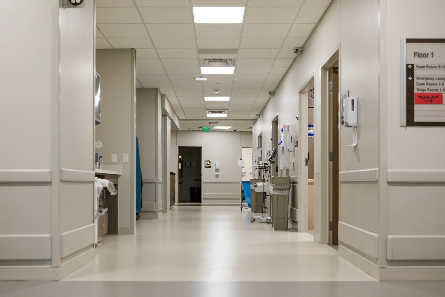 An empty corridor in a health care space with Beta Force lighting the area
