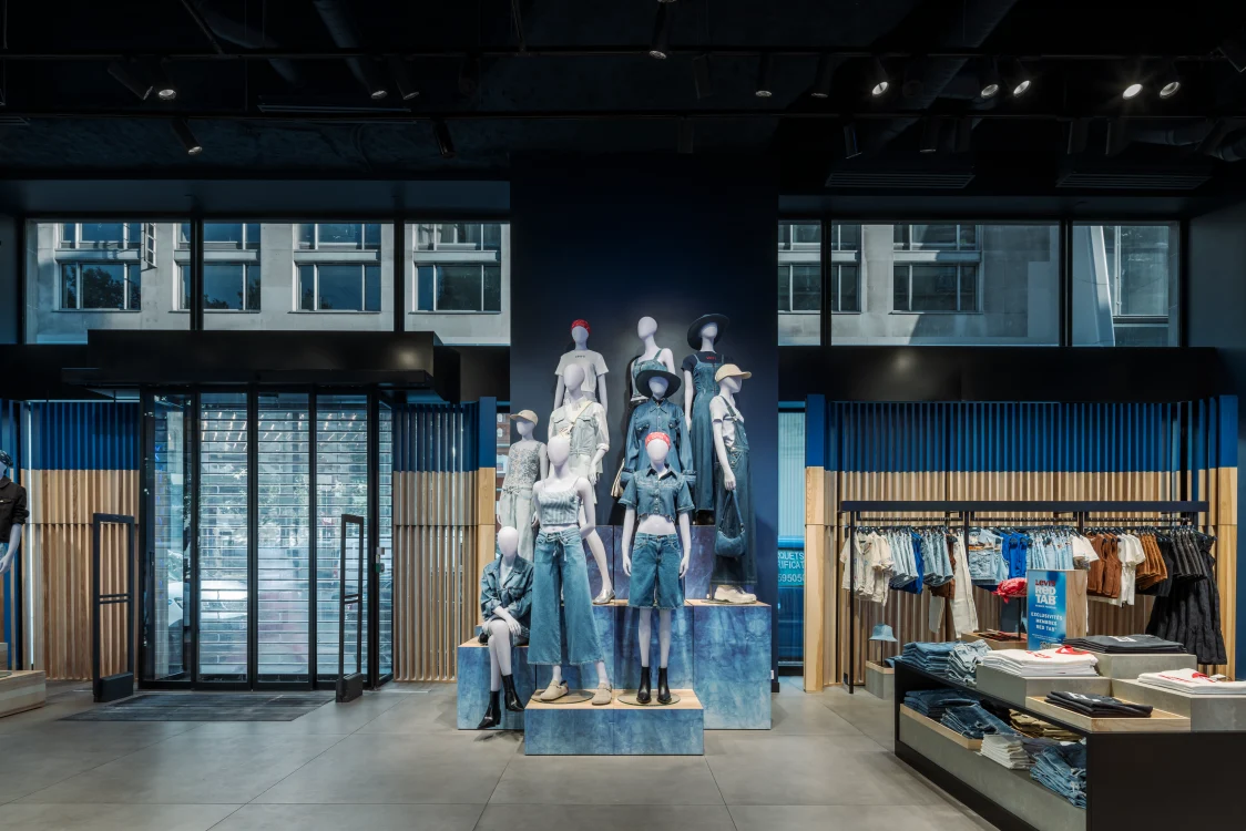 Interior view of the Levi Strauss flagship store with modern Zumtobel lighting, denim display, and clean retail architecture.