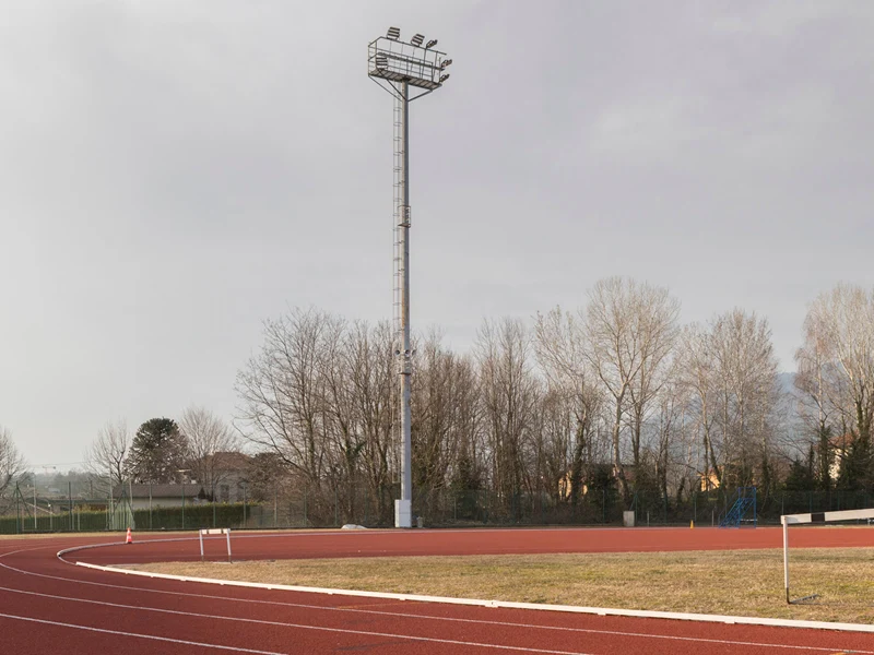 Champion floodlight stood on a pole over Campo di Atletica Varese, Italy