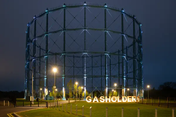 Granton Gasholder Edinburgh being illuminated at night