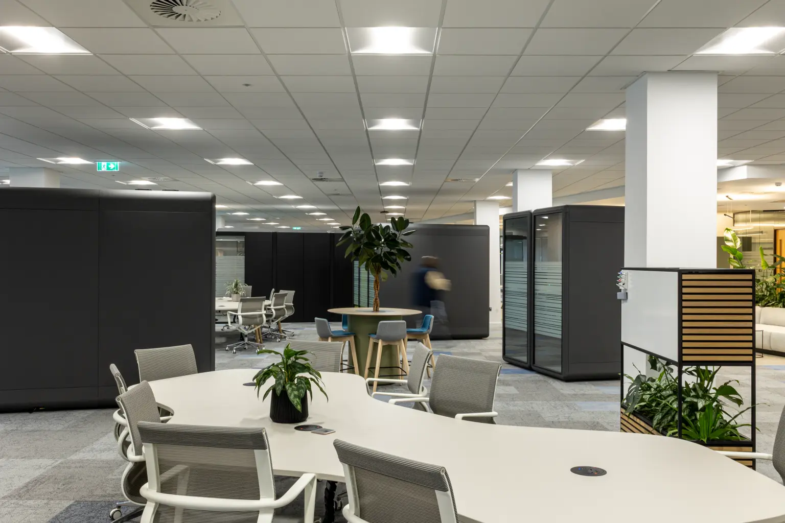 NG Bailey Headquarters, White Rose Office Park - Open plan office breakout space with a large modern desk and chairs