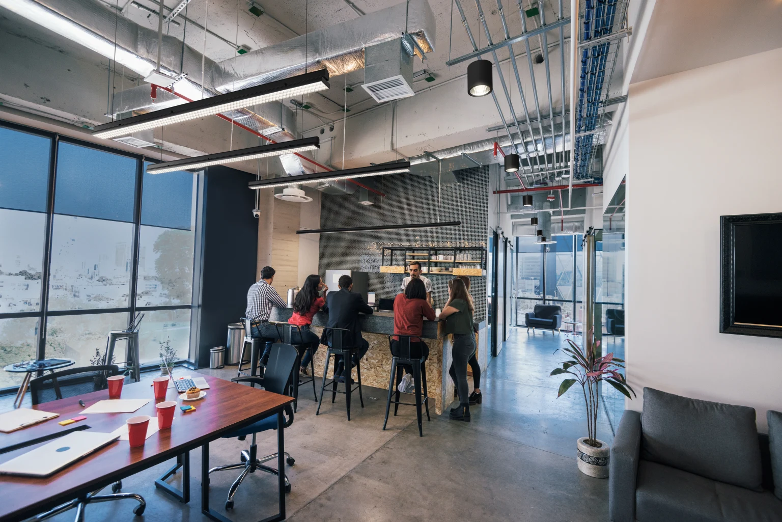 A coffee bar and working space lit by Arrowslim battens