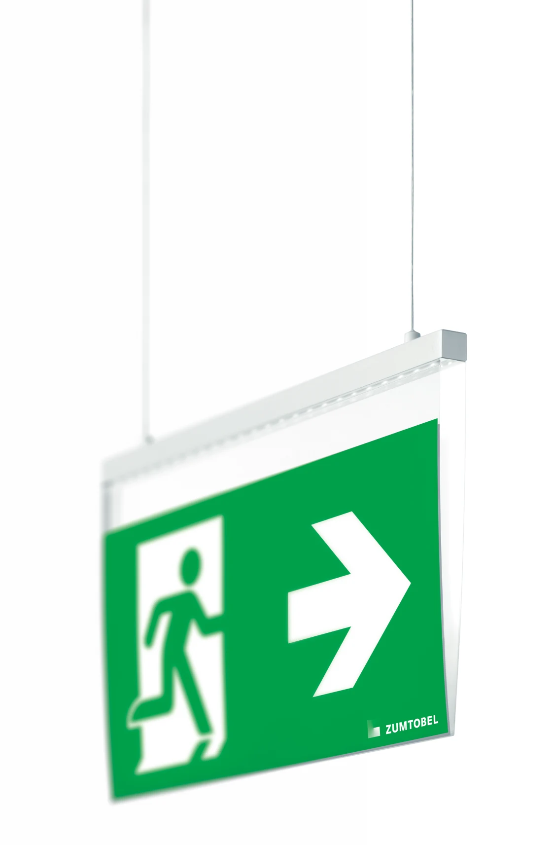 The COMSIGN 150 system is mounted on the ceiling and shows an illuminated green emergency exit sign with an arrow pointing to the right.
