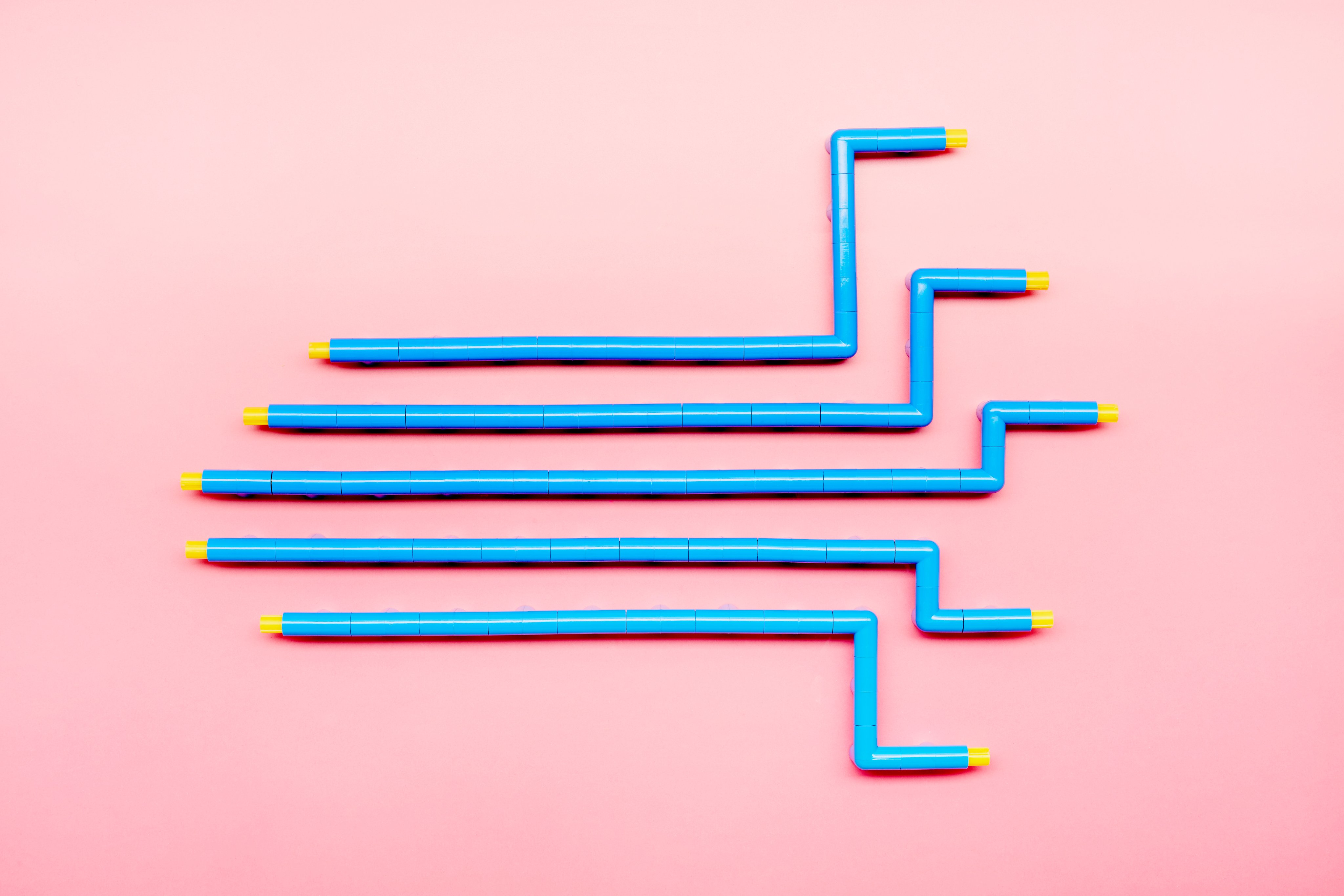 wooden blocks arranged in a staircase pattern on a blue background