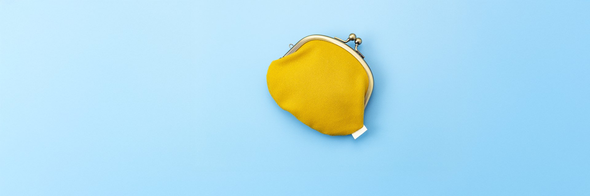 A yellow coin purse against a solid blue background.