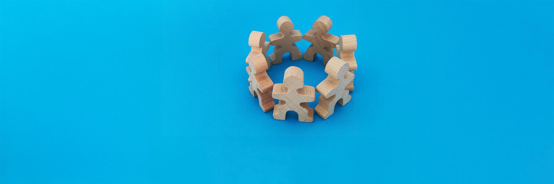 A wooden puzzle forms the shape of a house