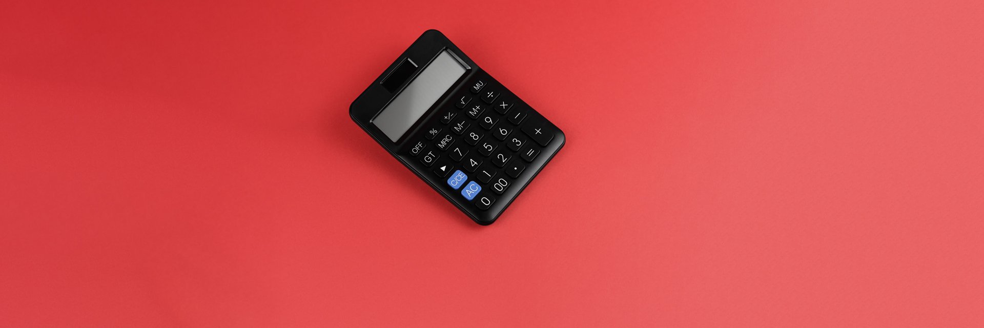 A handheld calculator on a red background