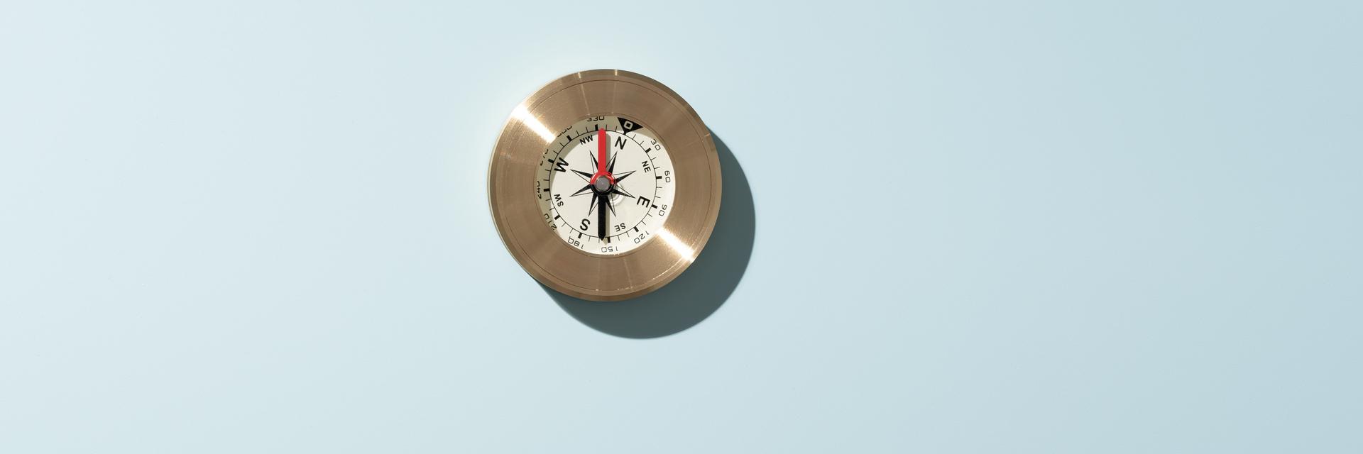 A silver compass