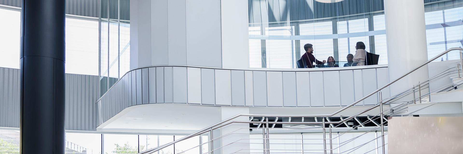 People talk in an office building