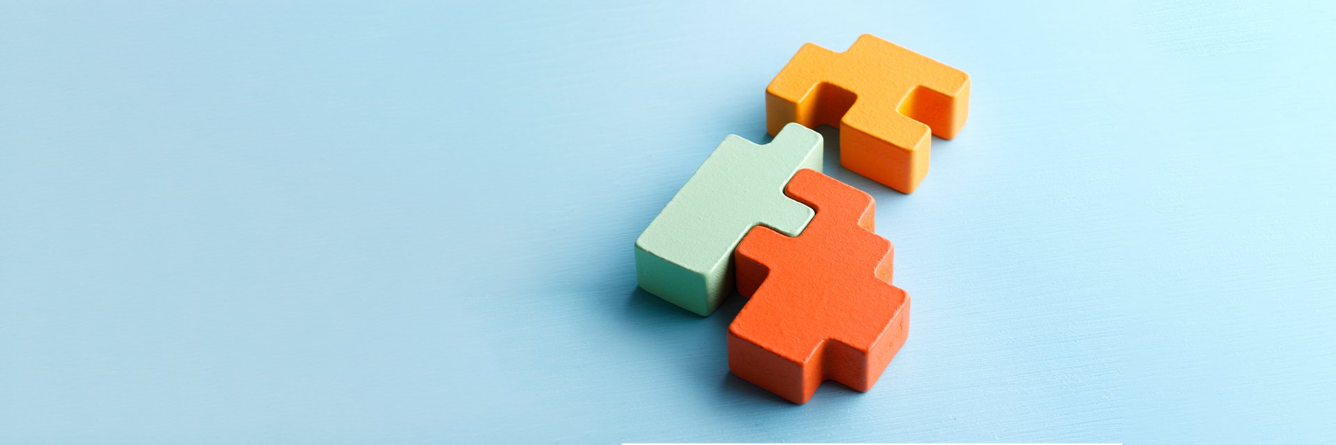 Colorful puzzle pieces on a blue background
