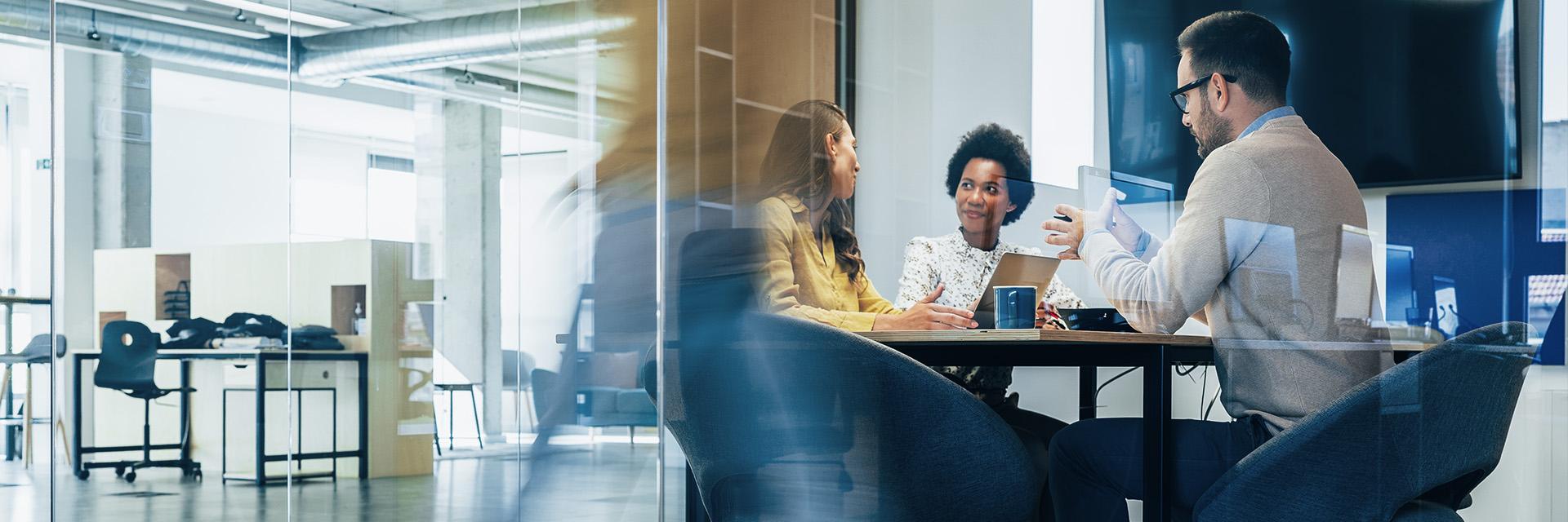 A group of people working at a meeting table