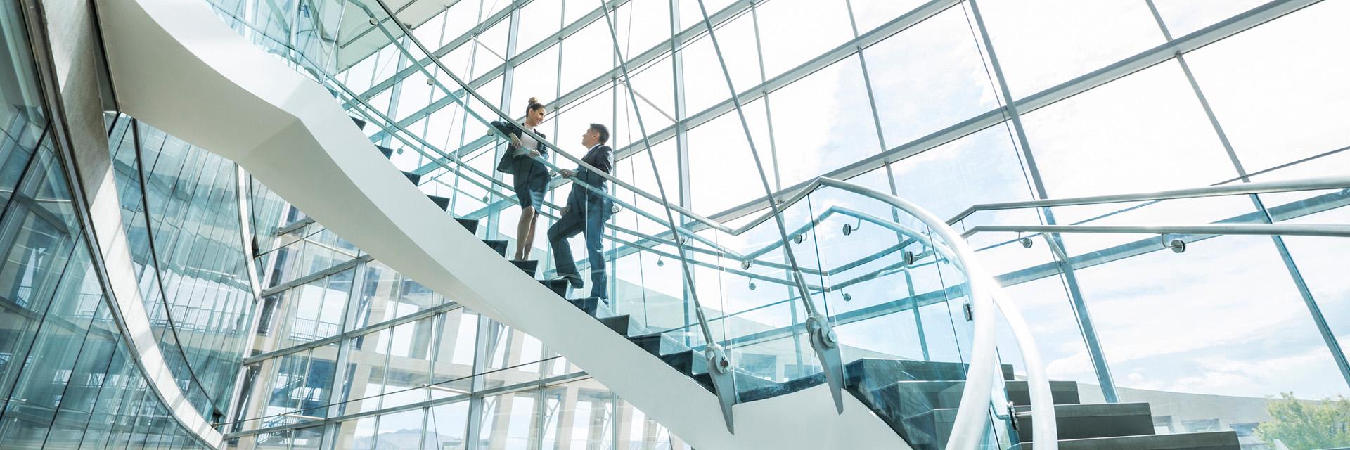 two-people-talking-on-circular-staircase