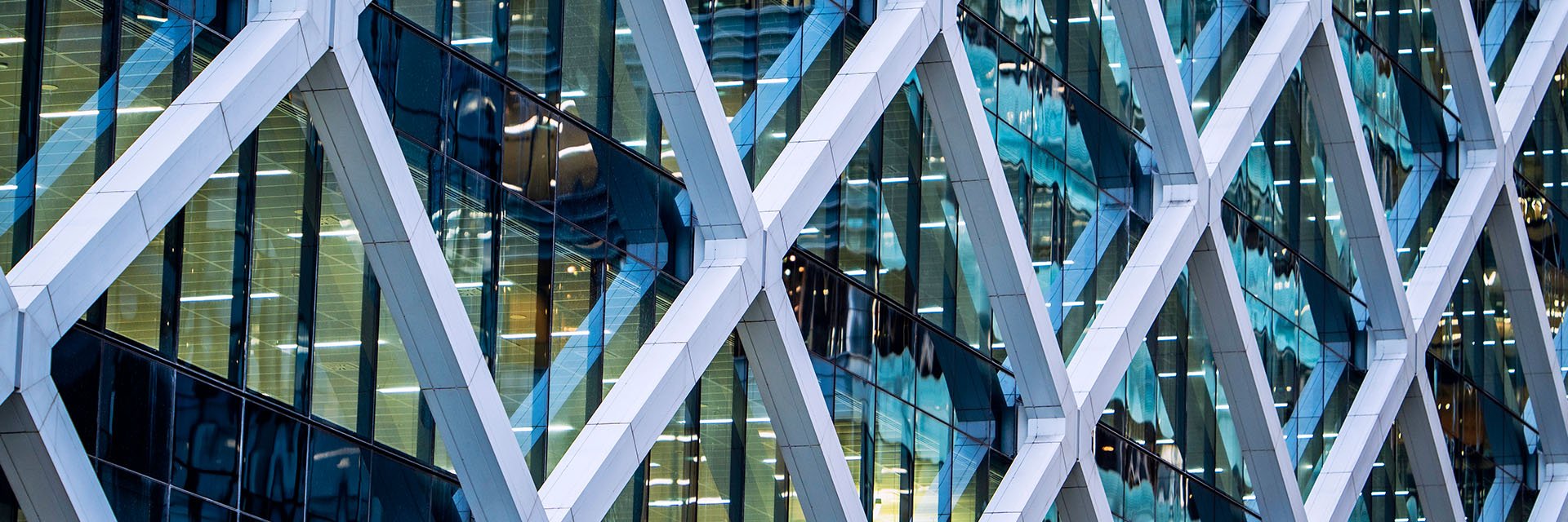 Triangular windows on the exterior of a large office building