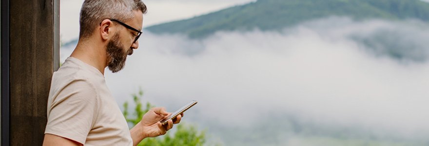 man-looking-at-phone-mountain-inline