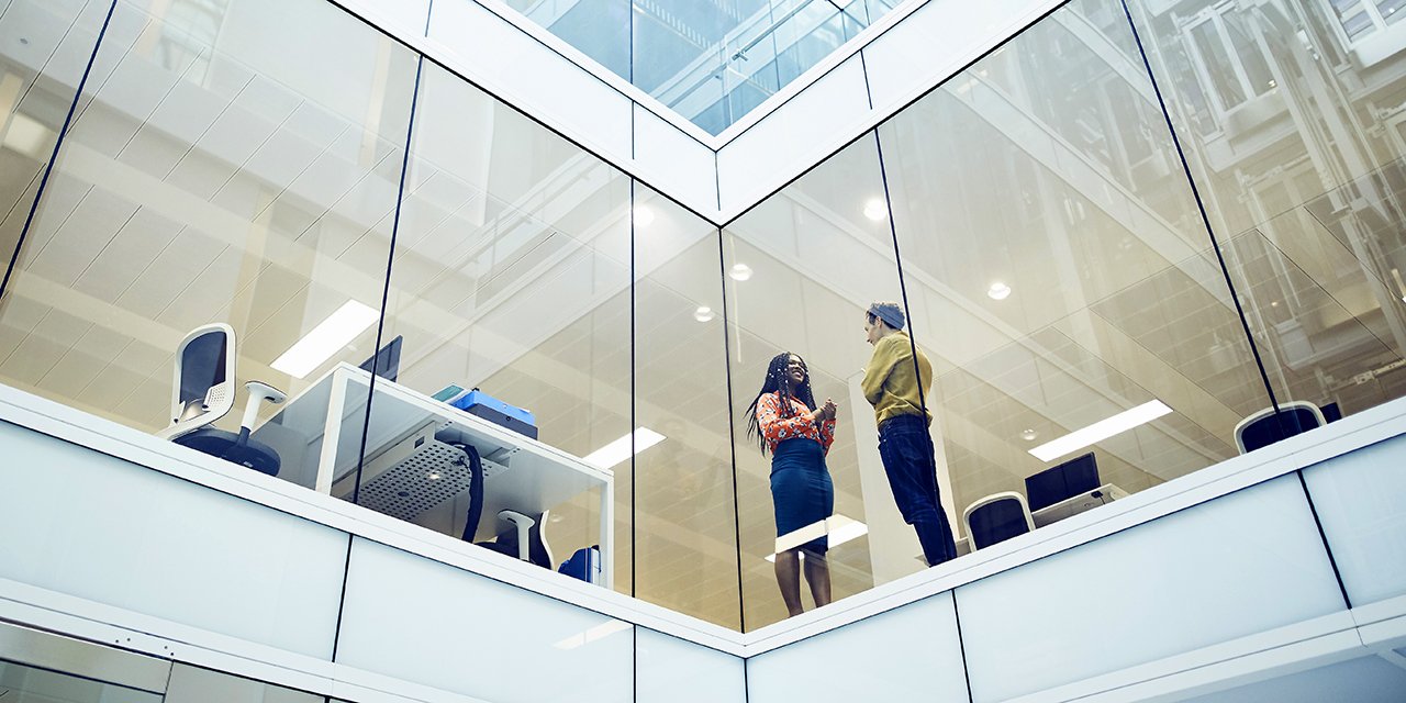 Colleagues-talking-in-modern-office