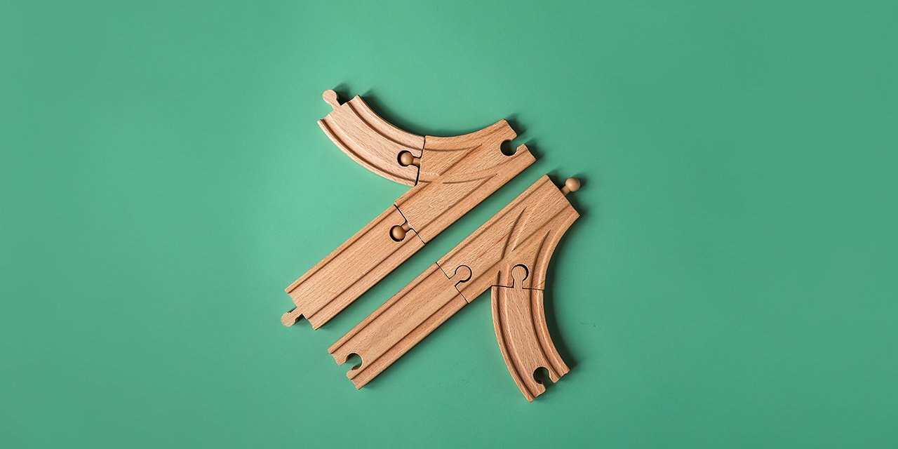 Wooden puzzle shapes on a green background