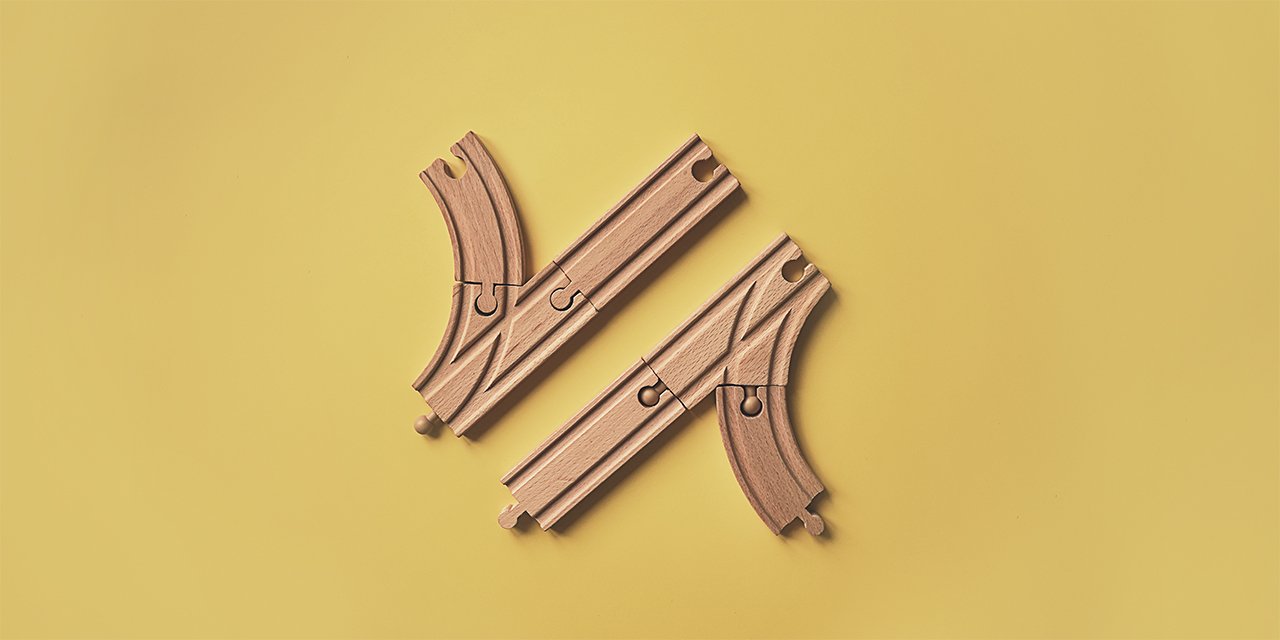 Wooden puzzle shapes on a yellow background