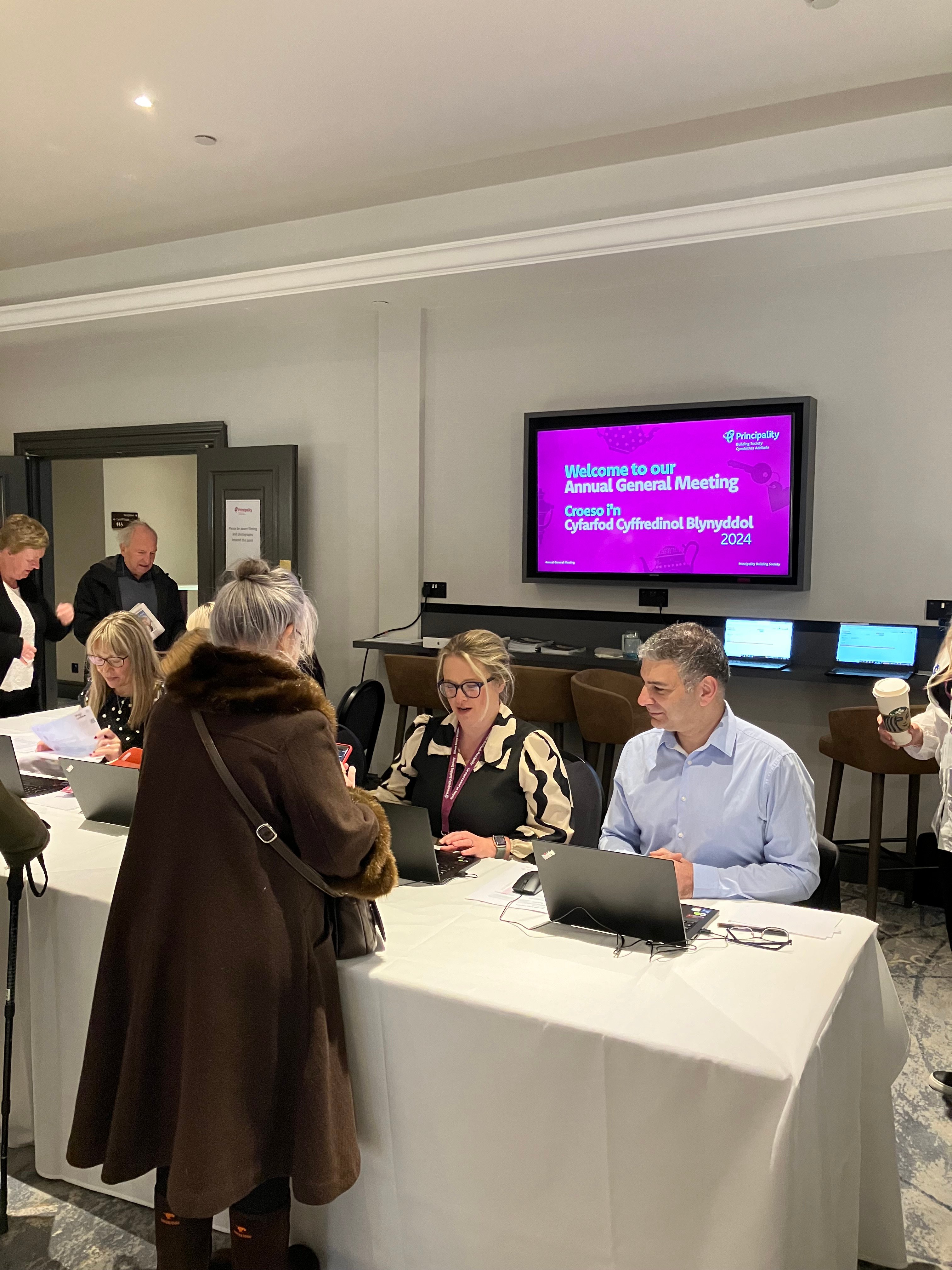 PBS members at the desk of AGM 2024