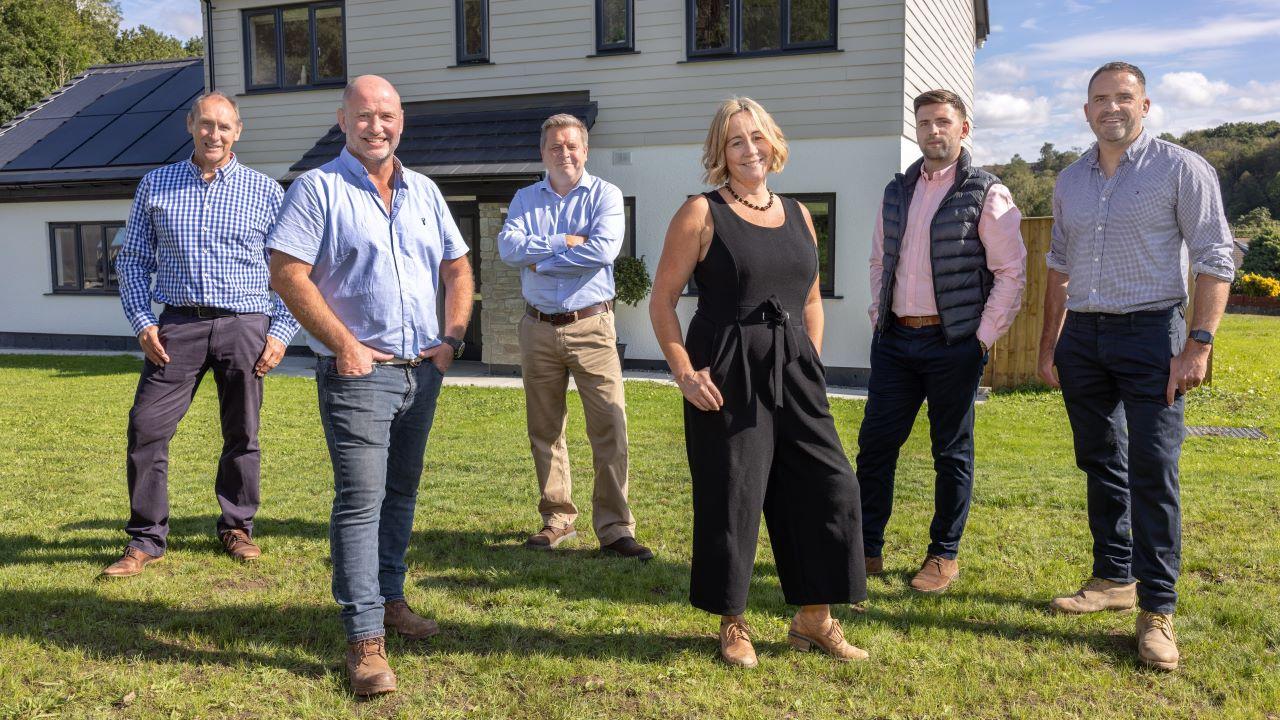 The team pictured at the housing development in Bryngroes, Ystradgynlais