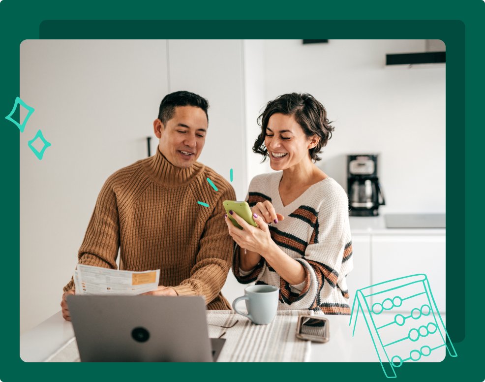 A couple sort their finances out together on a kitchen counter. 