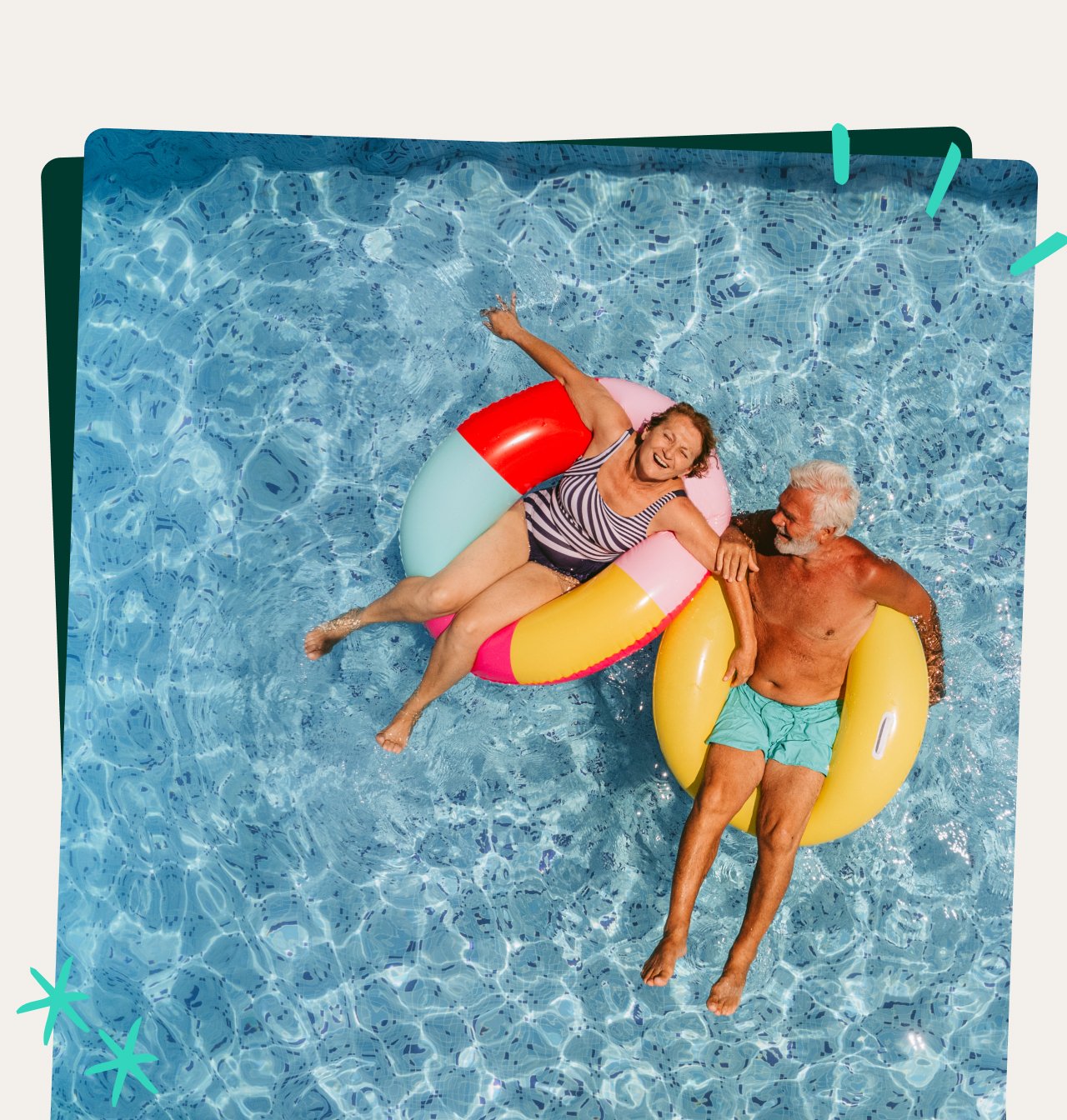 Photo of a senior couple floating on inflatable rings in the swimming pool and enjoying their golden years