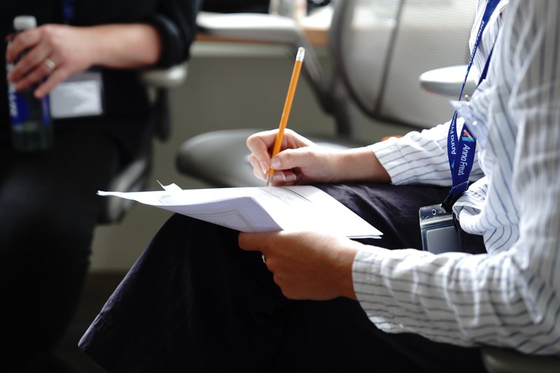 An Anna Freud employee taking notes during a meeting.                        