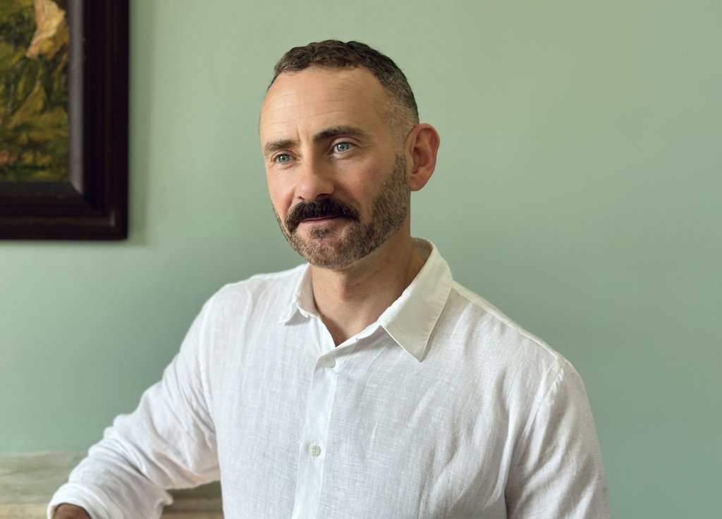 Eamon McCrory, Chief Executive of Anna Freud, photographed facing forward and looking to the side.