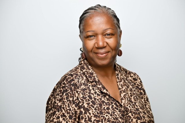 Marjorie James, Chief People Officer at Anna Freud, facing forward, smiling.