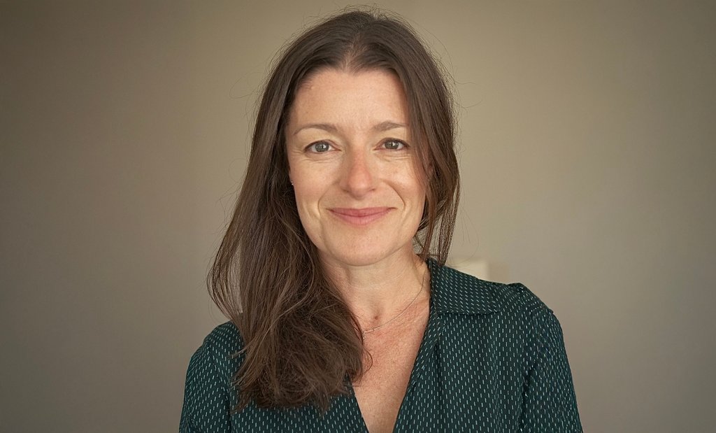 Louise Posocco, Finance Director at Anna Freud, facing the camera, smiling.