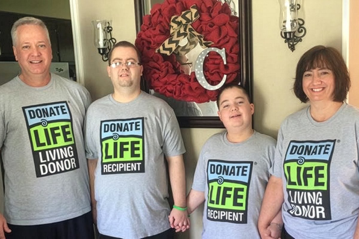The Childers family standing together and all wearing Donate Life shirts