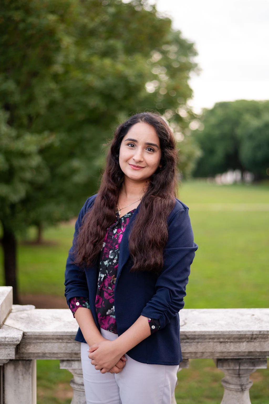 Farehaa Hussain, a pharmacy resident in health system pharmacy administration and leadership, poses on UVA grounds