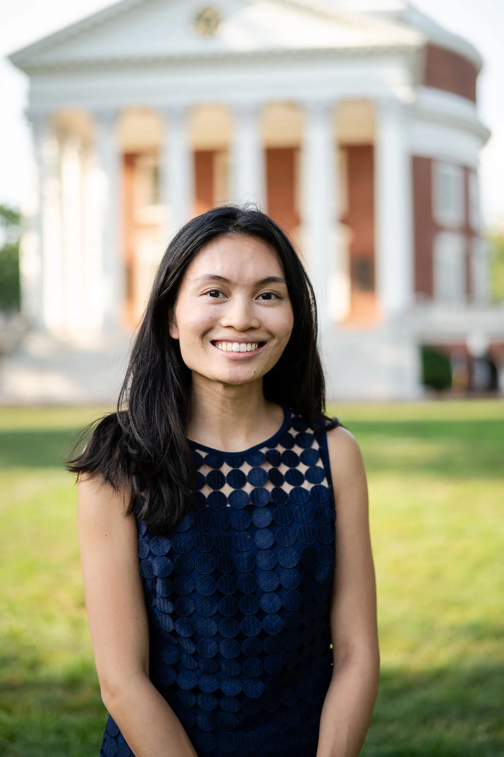 Avery Salcedo, an ambulatory care pharmacy resident, poses in front of the rotunda at UVA