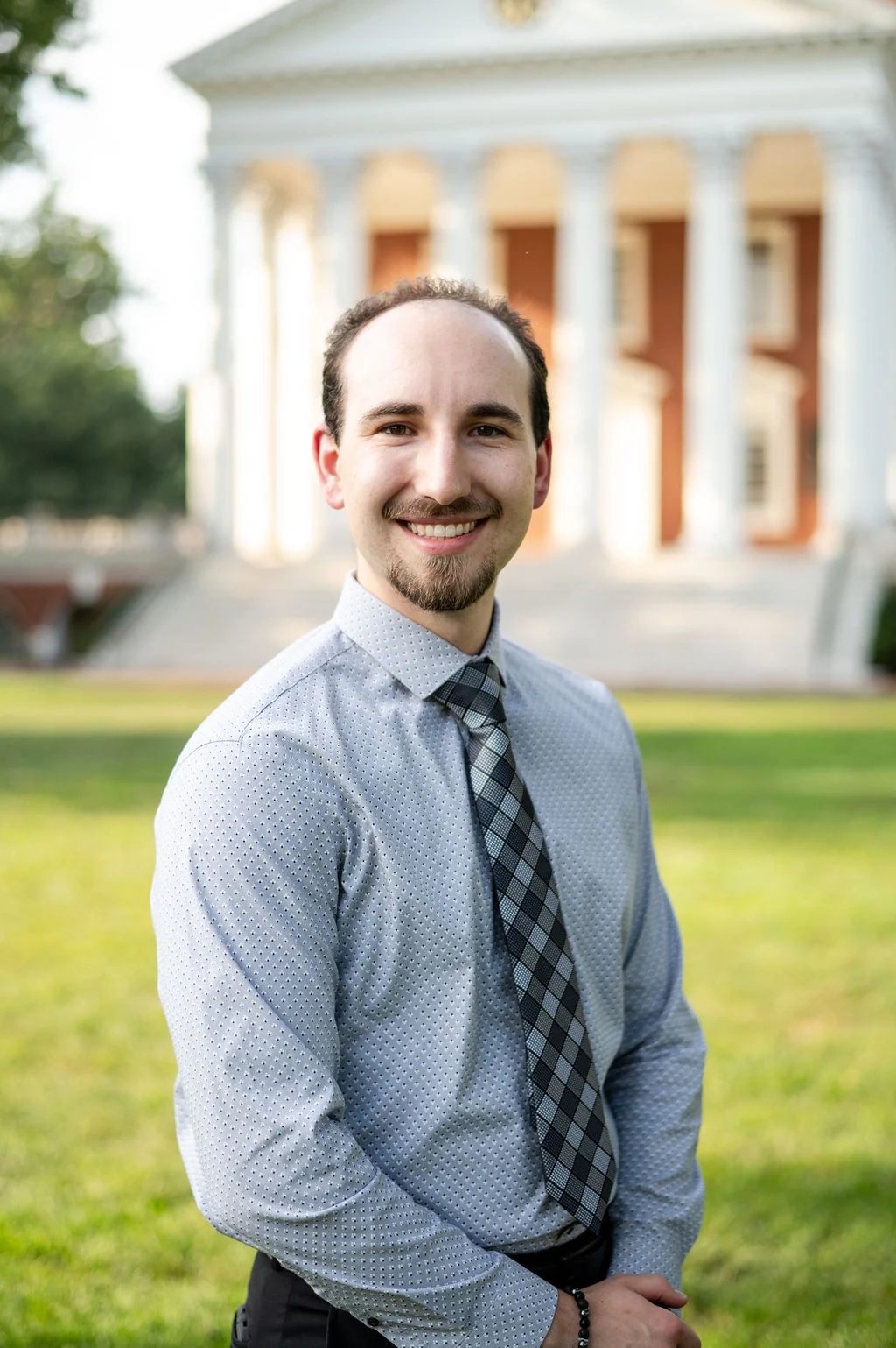 Maxwell Herbert an oncology pharmacy resident, poses in front of the rotunda at UVA