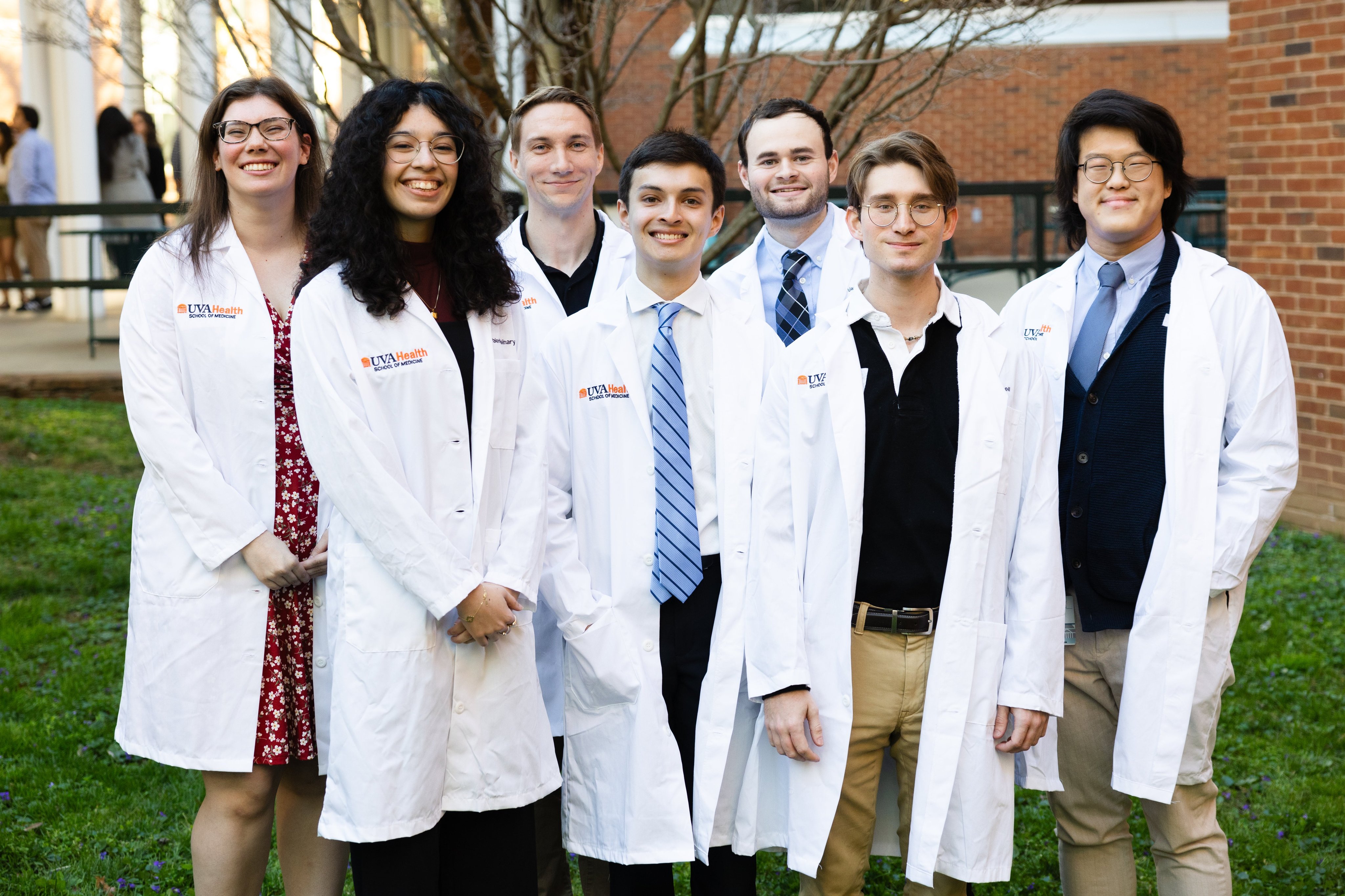 Students in their white lab coats