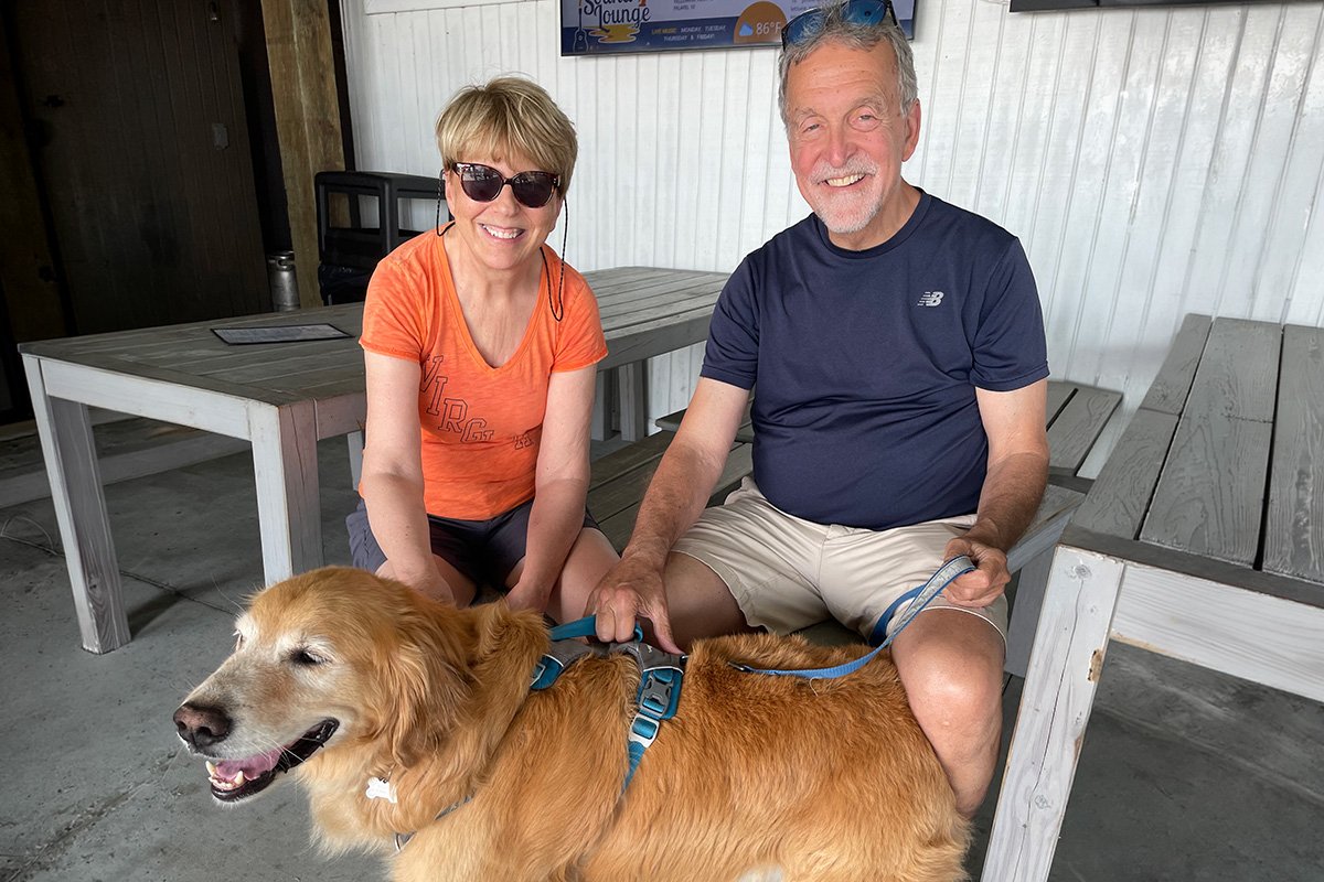 Susan and Jim pose with their dog