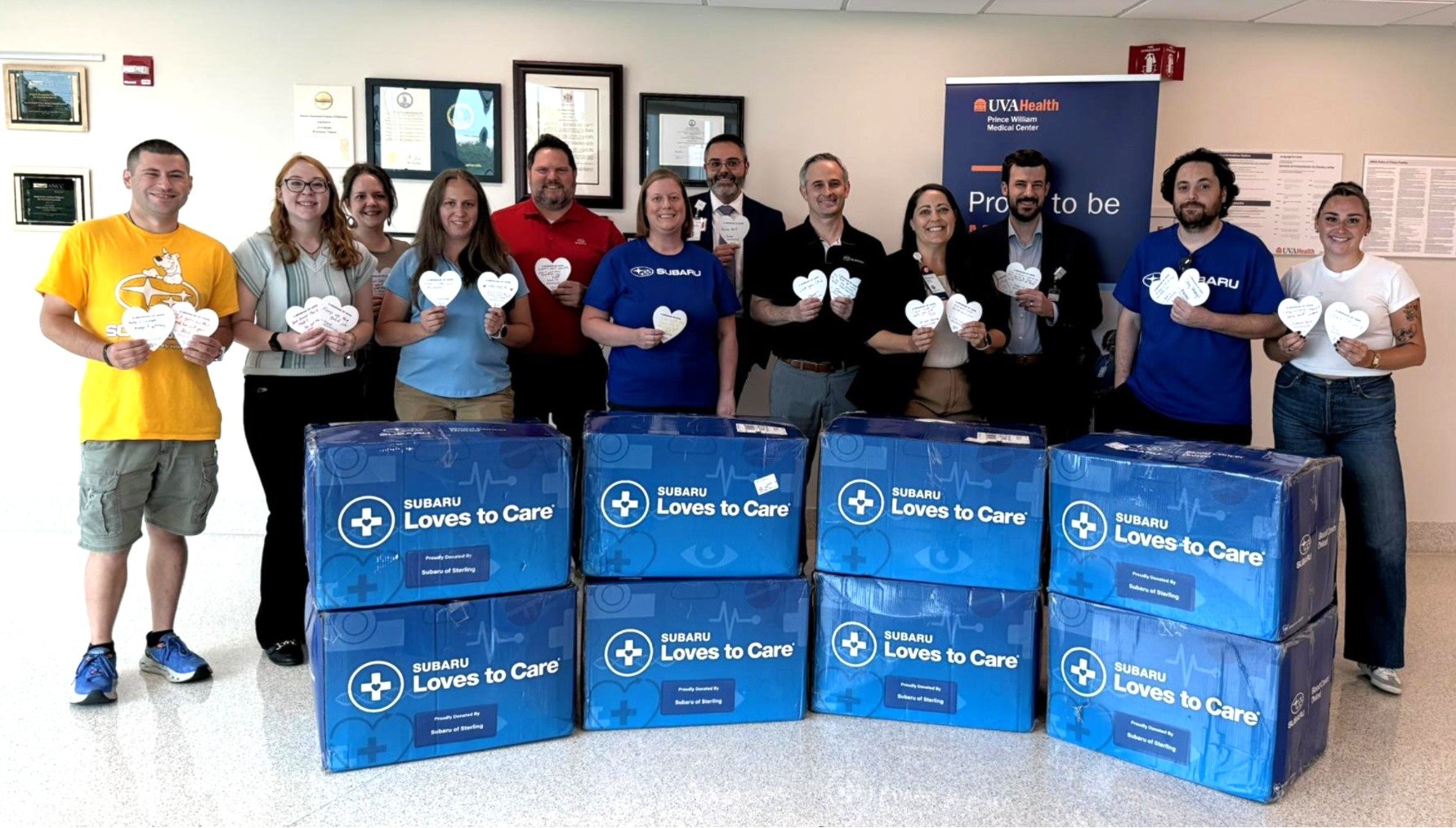 Photo shows team members from Subaru of Sterling, UVA Health Prince William Medical Center, Rep from Blood Cancer United and boxes of donations
