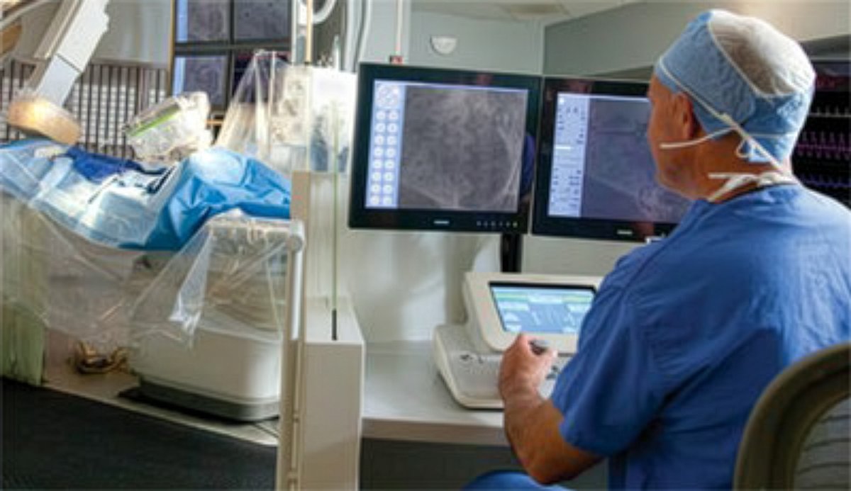 A surgeon using a robot to perform heart surgery