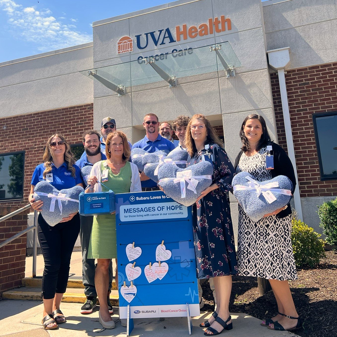 Picture in front of Cancer Care entrance at Culpeper Medical Center of Front row, left to right; Darcey Serio, Operations Director, Reynolds Subaru, Donna Staton, Chief Operating Officer, UVA Health Culpeper Medical Center, Susan Schreiner, Director of Operations and Ambulatory Radiology, UVA Health Northern Virginia and Culpeper Medical Centers, Ashley Carter, Director of Operations, UVA Health Culpeper Medical Center, back row, Bryce Matthews, Marketing & Digital, Brad Ennis, Inventory Manager, Andy Trice, Dealer Transportation, Reynolds Subaru, Jeff Say, Program Manager, Jackson Romero, Intern, Community Engagement, UVA Health Culpeper Medical Center.