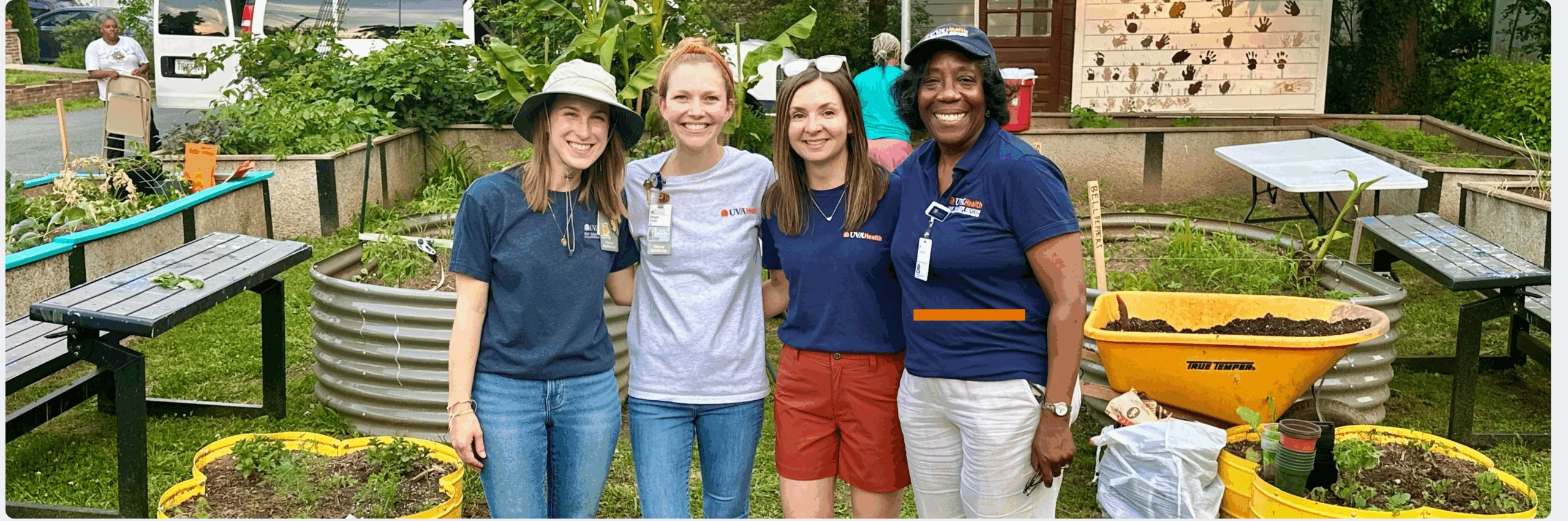 Medical students volunteering at a Charlottesville community garden