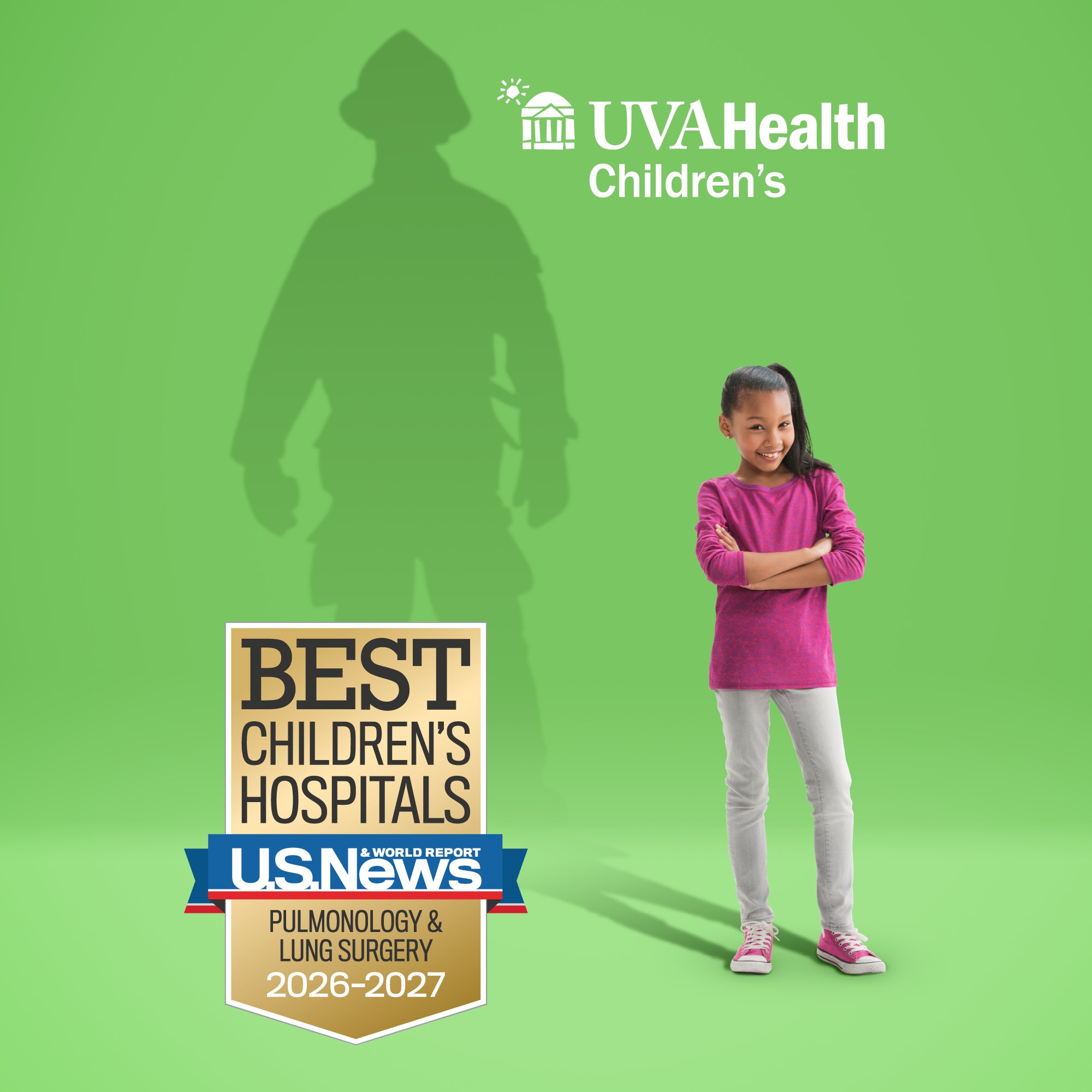 Girl stands in foreground with silhouette of firefighter in background