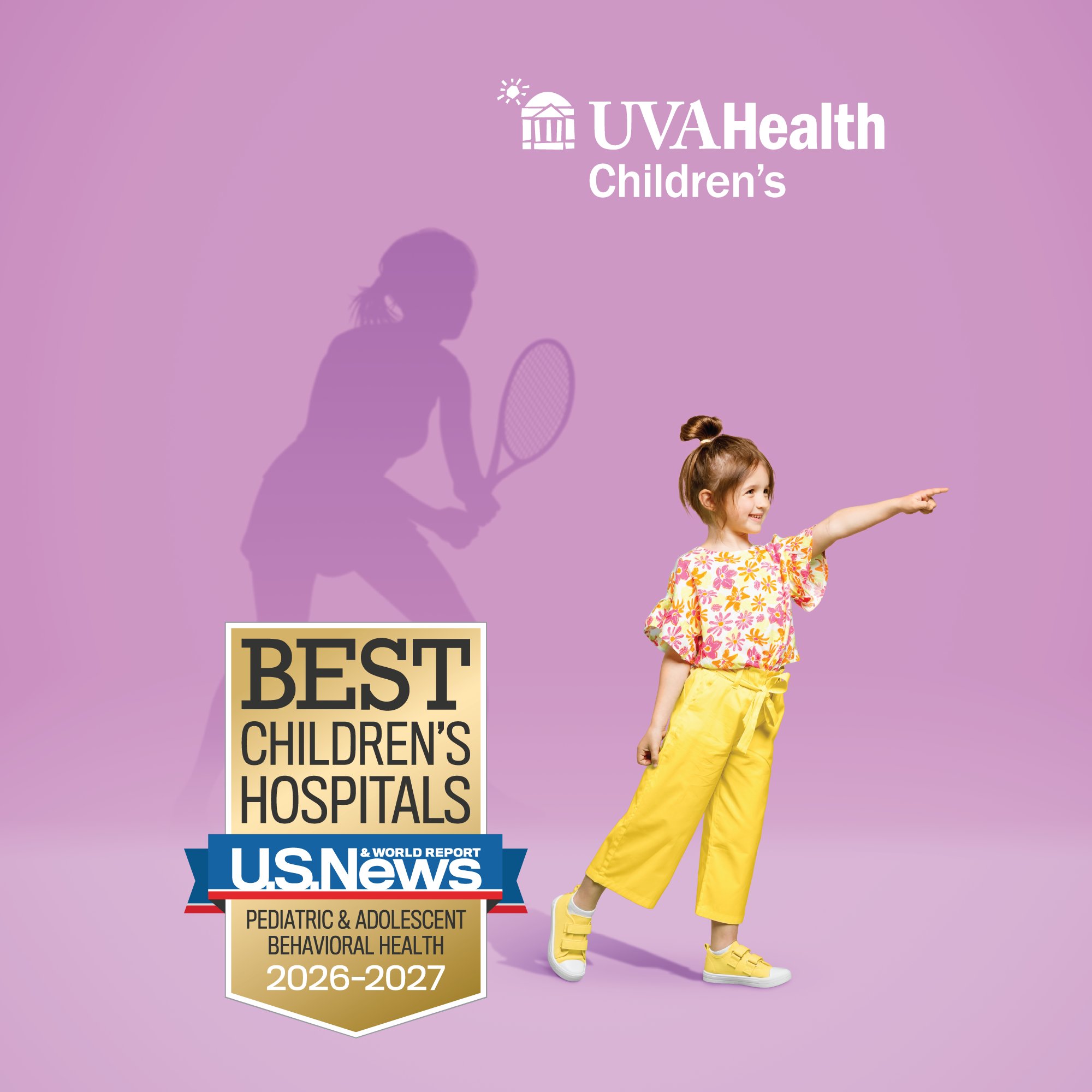 Little girl in yellow with tennis player silhouette in background