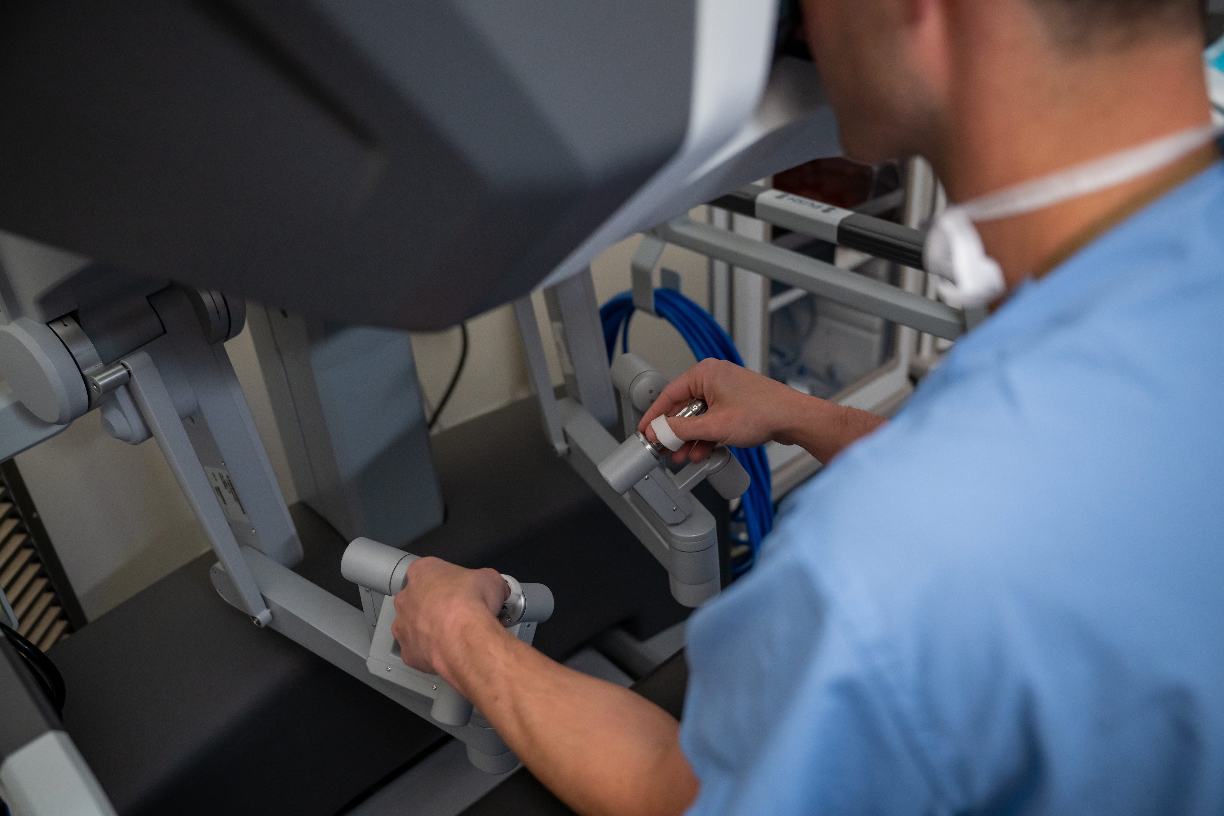 A UVA Health cardiac surgeon using the cardiac surgery robot