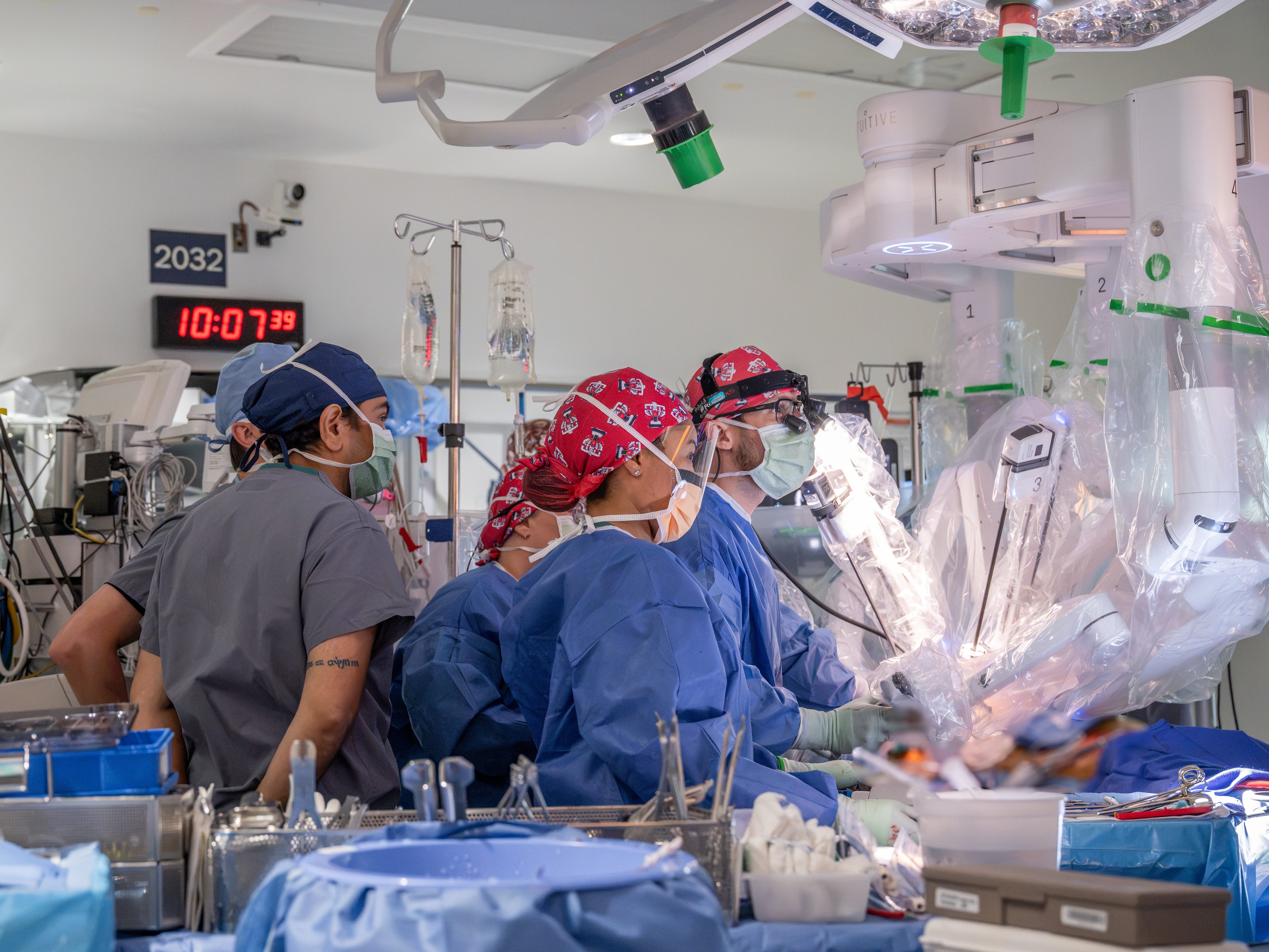 Ibrahim and other providers together during a robotic heart surgery