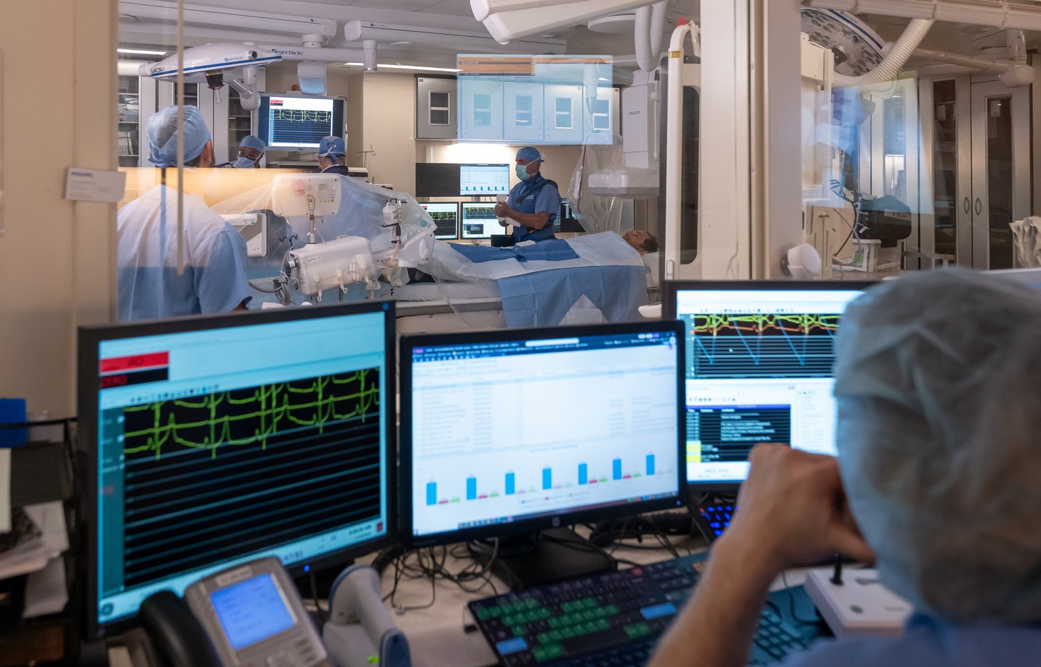 Providers on UVA Health's Heart & Vascular Institute team setting up Cath lab for a procedure 
