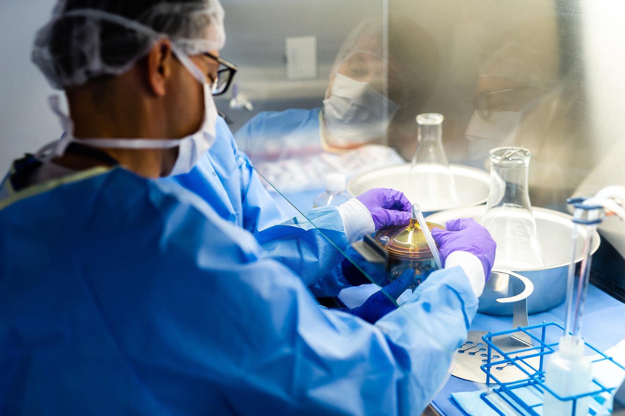 A researcher working with equipment in a lab