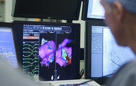 A doctor looks at heart imaging 