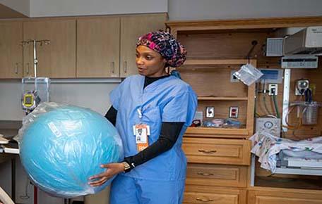 Nurse educator shows birthing ball