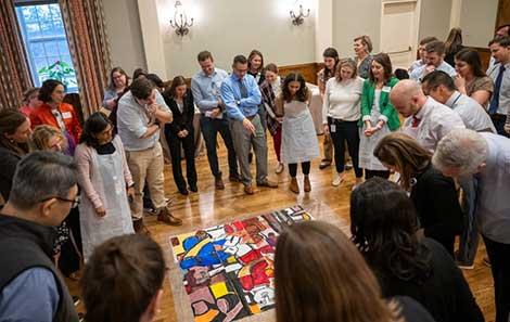 A group of HLI participants in a circle